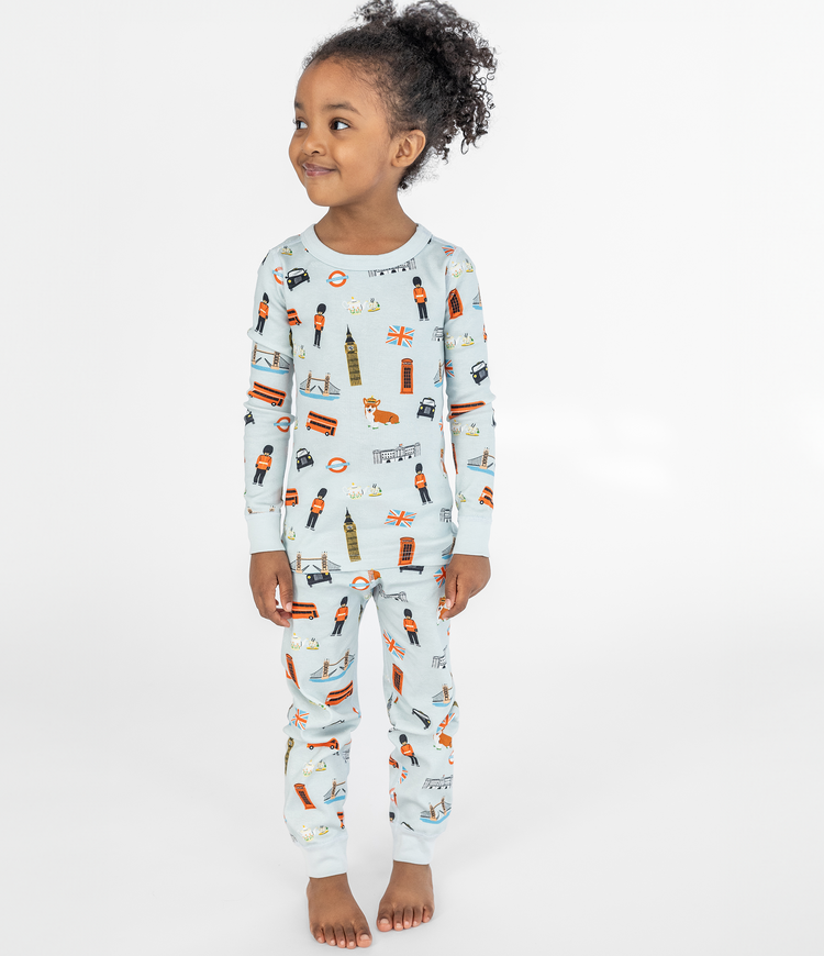 Stylish 4 year old girl with unique artist illustrations of London themed graphics,  100% organic cotton, Long john two piece set made for kids. Comfortable and cozy sleepwear.