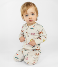 Adorable Blue Eyed Baby in a Fun Texas Themed One Piece Sleepwear. Zip-up and Comfortable. Cozy and Stretchy Wear. Ribbed Cuffs. Machine-Wash Friendly Material made from 100% Organic Cotton.