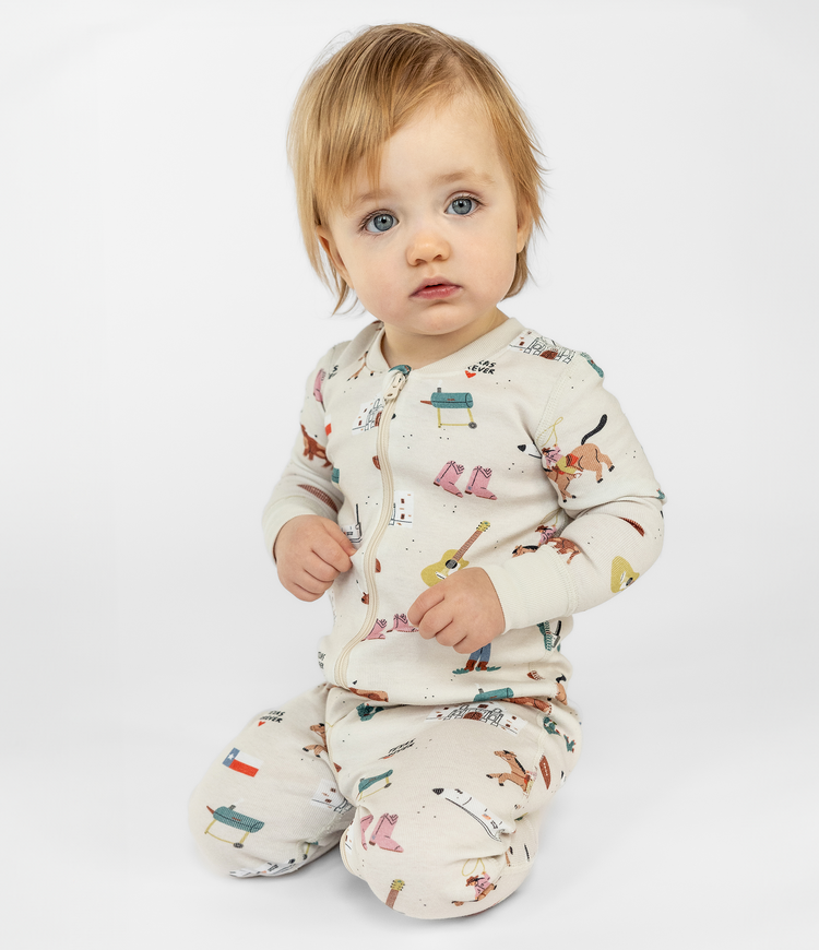 Adorable Blue Eyed Baby in a Fun Texas Themed One Piece Sleepwear. Zip-up and Comfortable. Cozy and Stretchy Wear. Ribbed Cuffs. Machine-Wash Friendly Material made from 100% Organic Cotton.