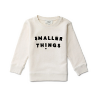 Stylish Bone Colored Sweatshirt with Smaller Things Logo. 100% Organic Cotton. Crewneck for Young Boys and Girls. Fashionable and Cozy to Wear. Velvet Lettering Logo.