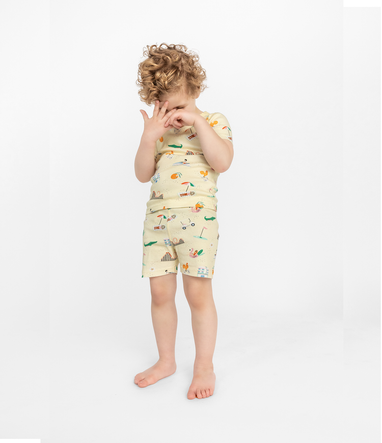 Child Posing in Smaller Things Short Pajama Set - Fun Florida-themed print on 100% organic cotton short sleeve top and bottom